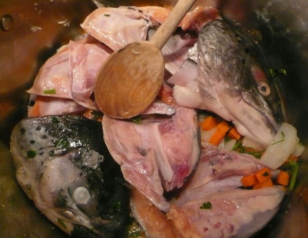 Saute the vegetables and salmon heads